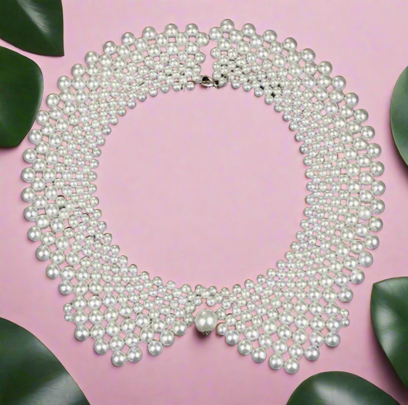 White faux pearl Peter Pan collar bib necklace, vintage-inspired statement jewelry on black bust display