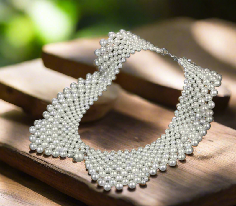 White faux pearl Peter Pan collar bib necklace, vintage-inspired statement jewelry on black bust display