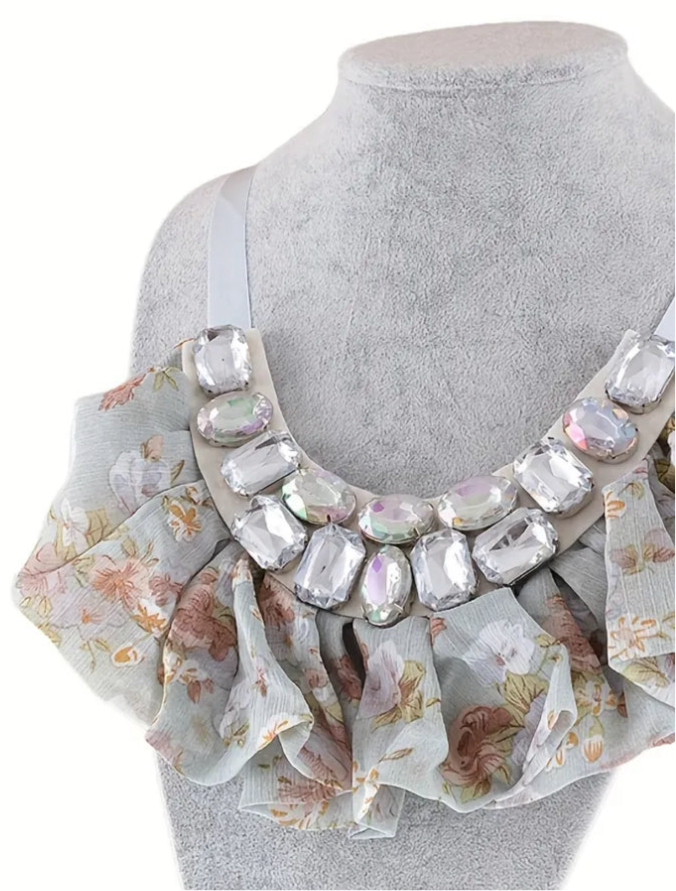 Floral ruffle bib necklace with large clear crystals and satin ribbon ties, vintage-inspired statement jewelry