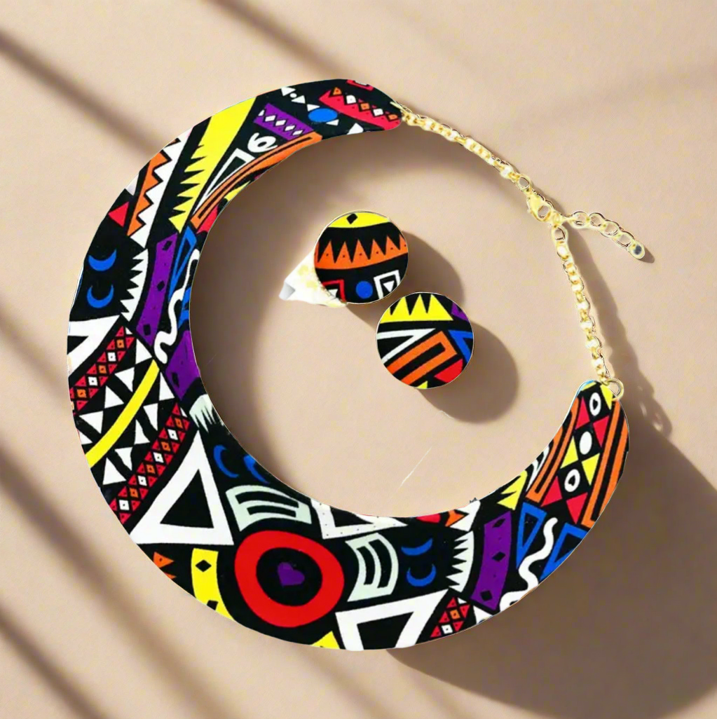 Colorful African tribal pattern bib necklace with matching round stud earrings, featuring geometric shapes in red, yellow, black, white, purple, and orange with gold-tone adjustable chain.